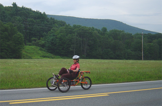 E rides Orange trike